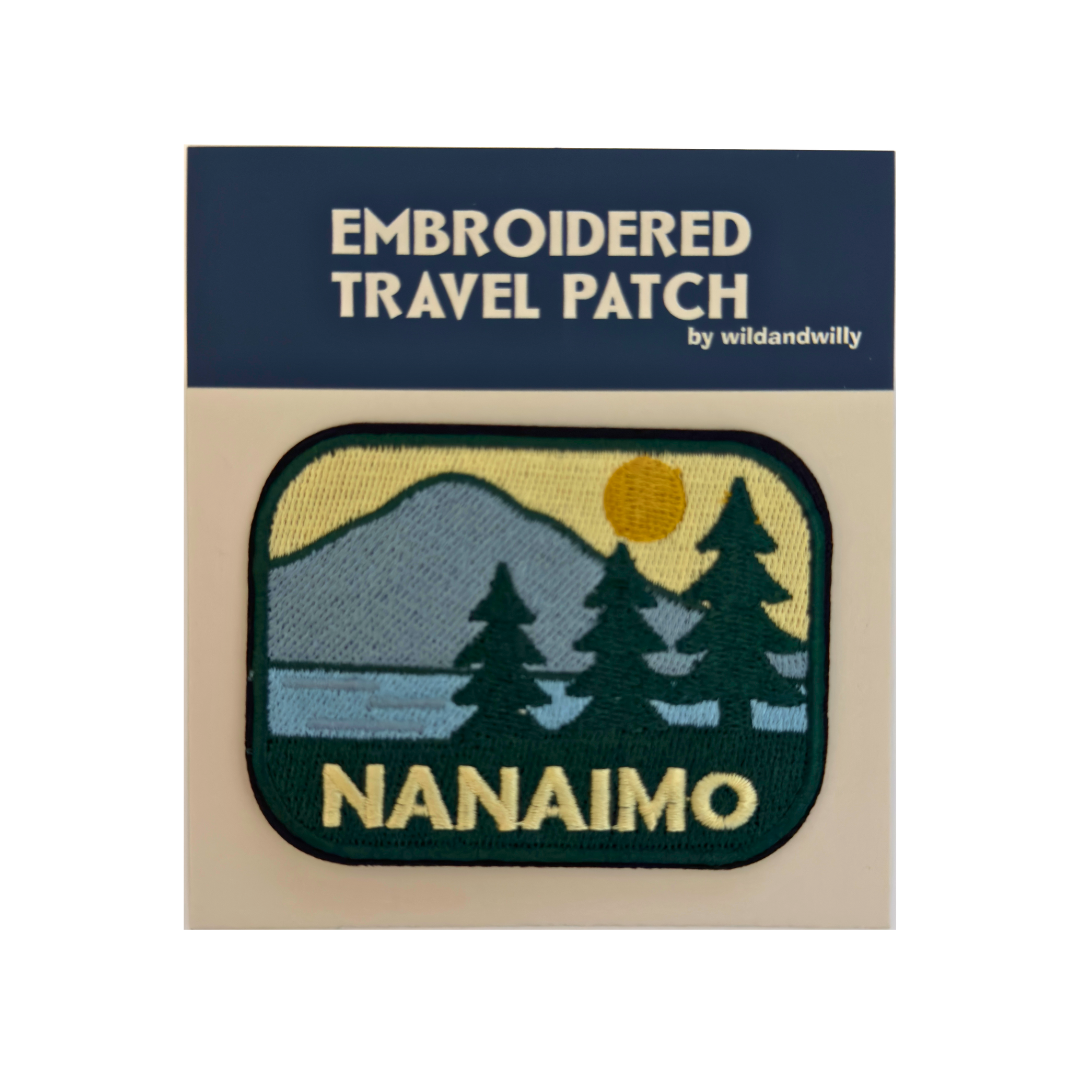 Embroidered travel patch of nanaimo with mountain and trees design on packaging