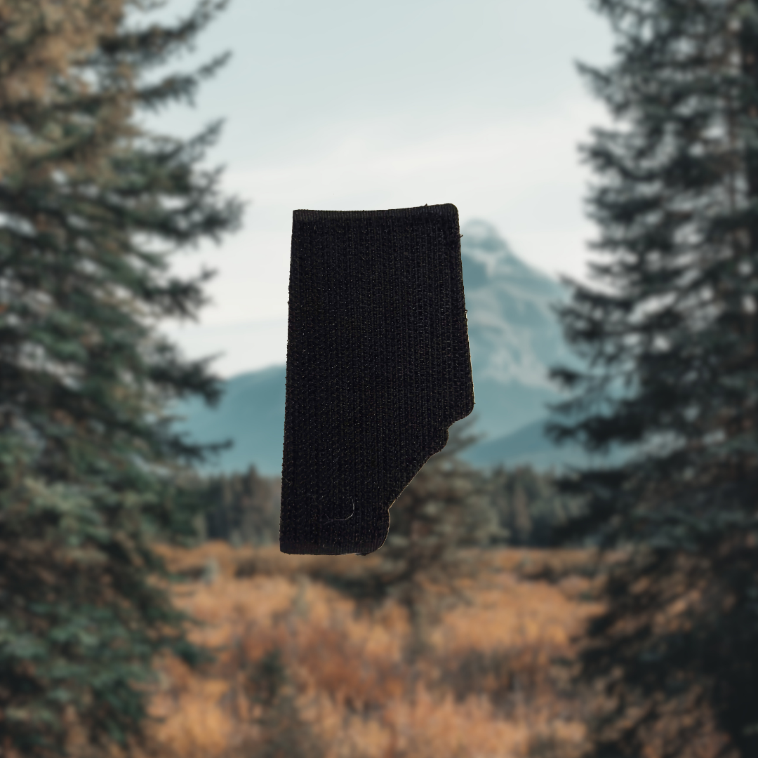 alberta patch velcro against a blurred natural background with trees and mountains