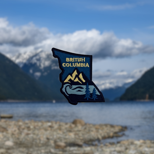 patch of British Columbia with mountains and trees against a mountain lake backdrop