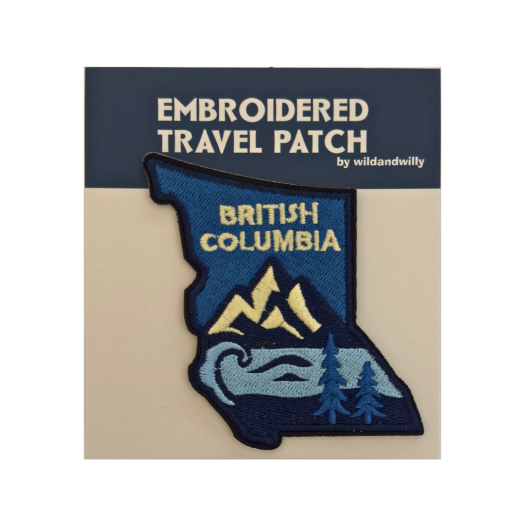 Embroidered travel patch of British Columbia on a card with branding text.