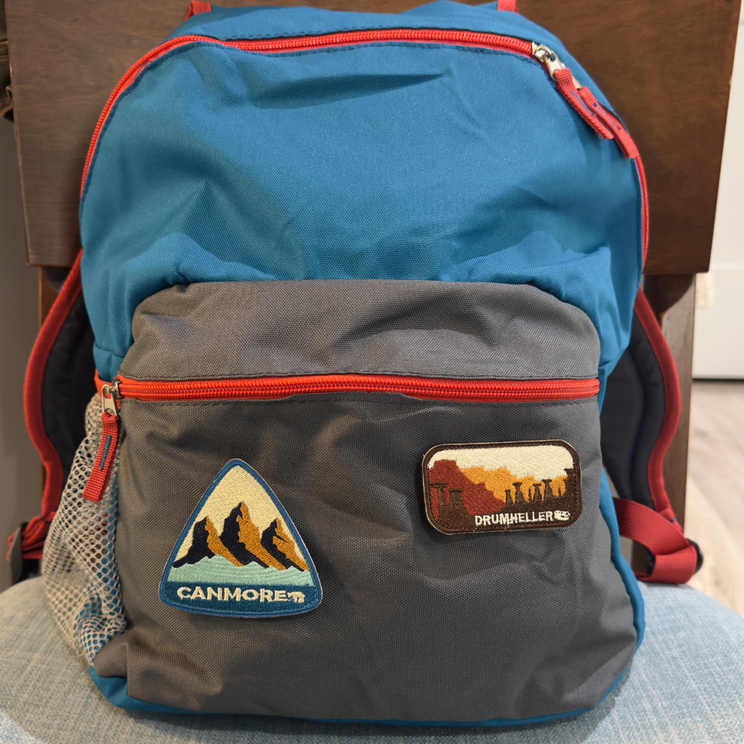 canmore and drumheller travel patch on a backpack