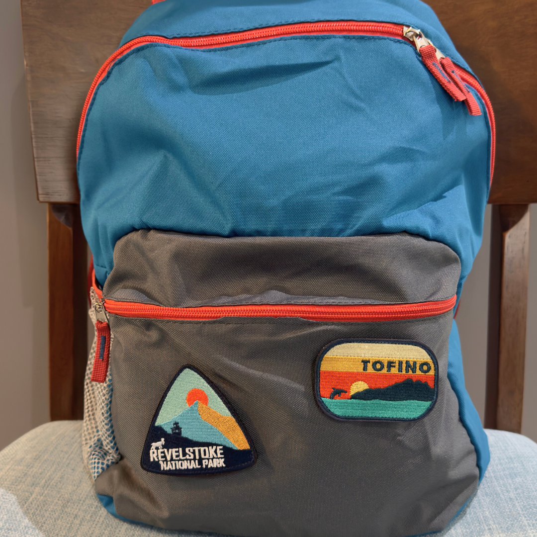 tofino and revelstoke national park travel patch on a backpack