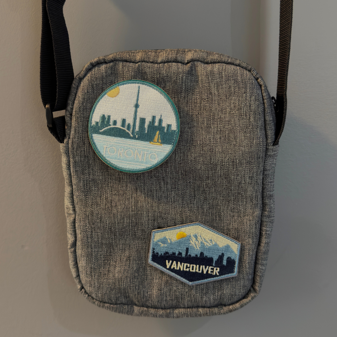 toronto and vancouver travel patch on a backpack